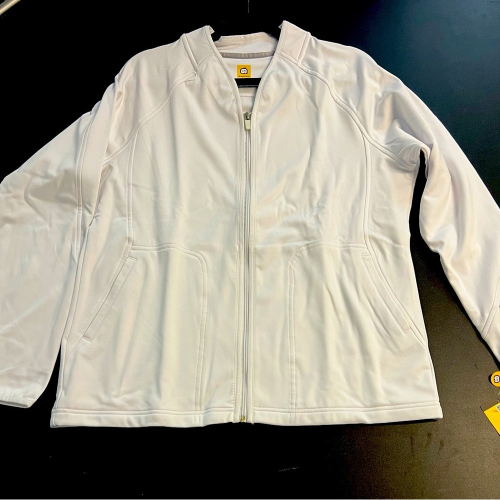 This women's fleece jacket zips up over your scrubs, and has plenty of pockets.